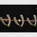 Wish Bone Brooch | Period: Edwardian c1910 | Make: Handmade. | Material: 18ct gold, sapphire, ruby, diamond and seed pearls.