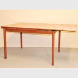 Retro Extension Table | Period: Retro 1960s | Make: Parker (attrib.) | Material: Teak | Table with one leaf extended.