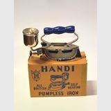 Handi Pumpless Spirit Iron | Period: 10th February 1985 | Make: Handi Works P/L | Material: Steel with timber handle.