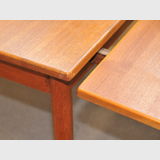 Retro Extension Table | Period: Retro 1960s | Make: Parker (attrib.) | Material: Teak | Table showing how leaf slide under.