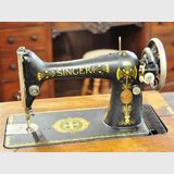 Singer Sewing Machine | Period: c1917 | Make: Singer | Material: Various metals with American Oak case.