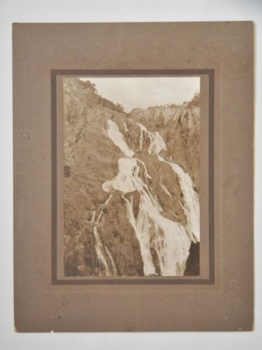 Barron Falls Photograph | Period: 1920s | Make: The Regent Commercial Co, Brisbane | Material: Sepia photograph on board.