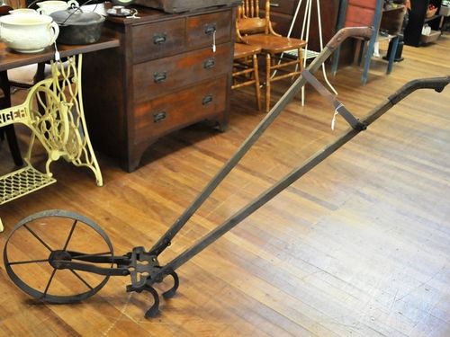 Cultivator | Period: c1920s | Material: Steel with timber handles