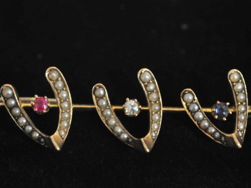 Wish Bone Brooch | Period: Edwardian c1910 | Make: Handmade. | Material: 18ct gold, sapphire, ruby, diamond and seed pearls.