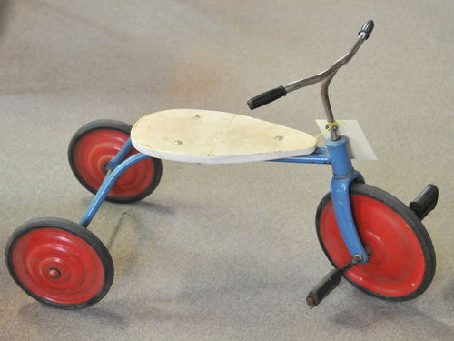 Tricycle | Period: c1920s | Material: Steel with wood seat.