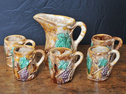 Harvey School Lemonade Set | Period: 1938 | Make: Florence Archer | Material: Pottery | Jug & 5 mugs by Florence Archer featuring branches, leaves and grapes.